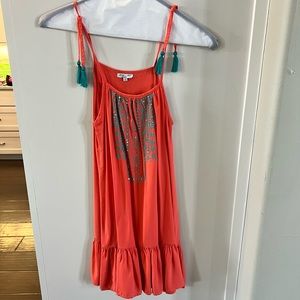 Joyous coral sleeveless dress with turquoise tassels.